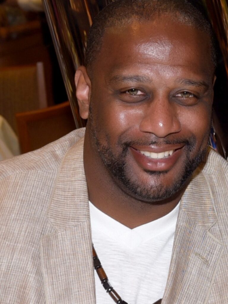 Man with white shirt and sports coat