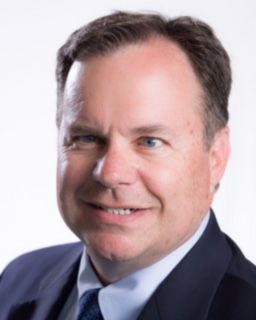 Shelby school board candidate Carl Ridenour smiles for photo.