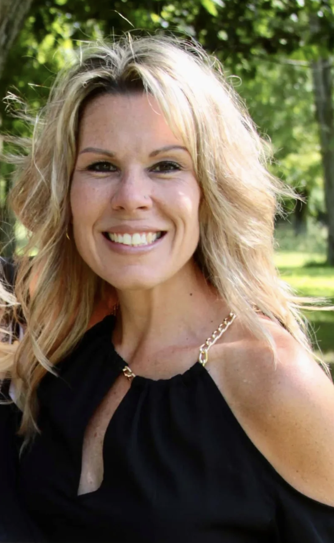 Shelby school board candidate Heather Braun smiles for photo.