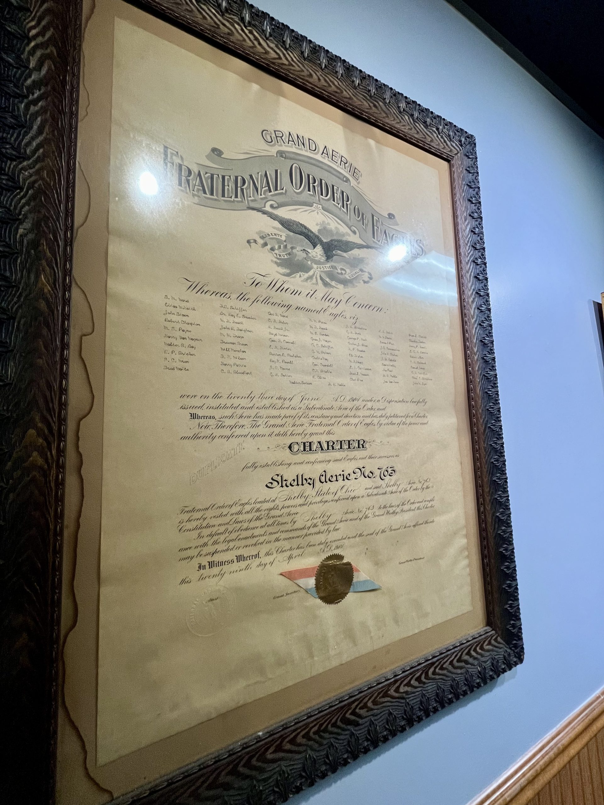 Historic document hangs on the Shelby Eagles wall.