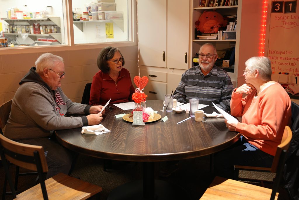 customers sit at a table at the Ramble Inn