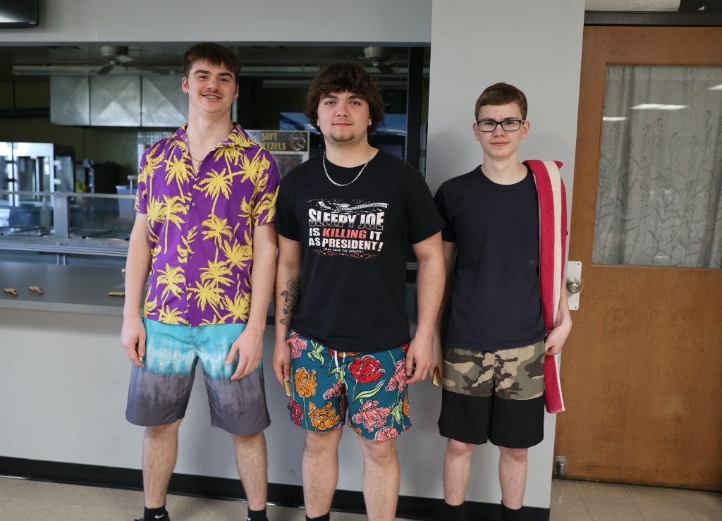 winning students pose for a photo at cardboard boat regatta