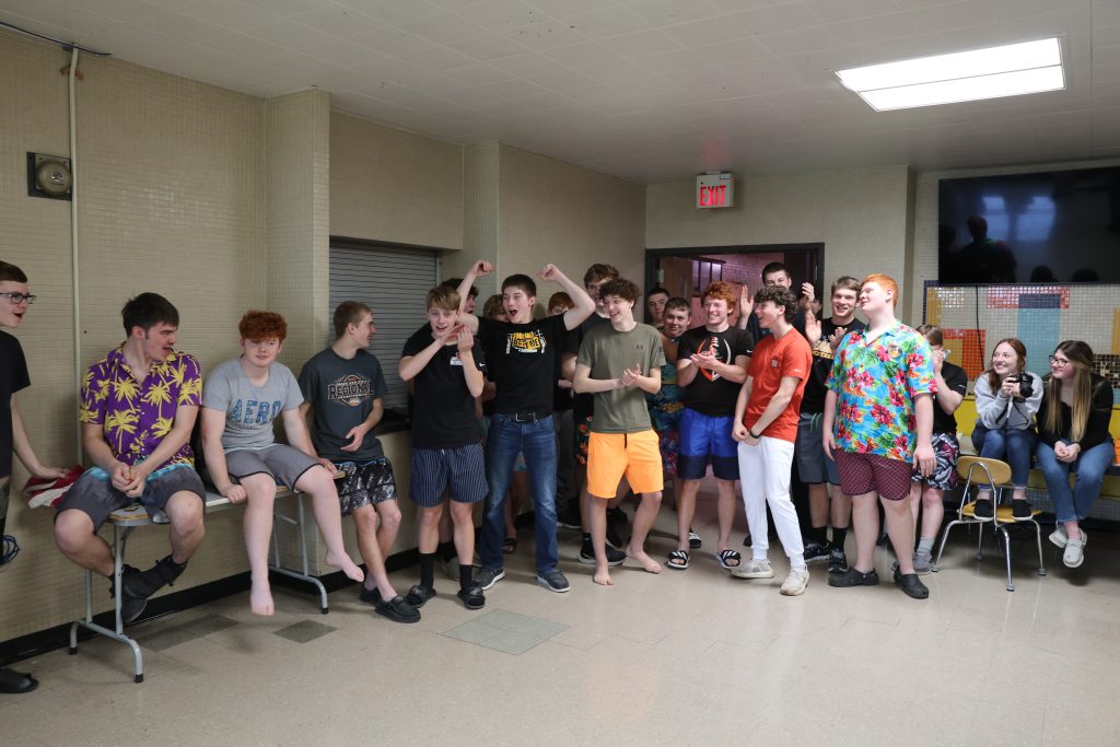 students cheer during awards portion of cardboard boat regatta